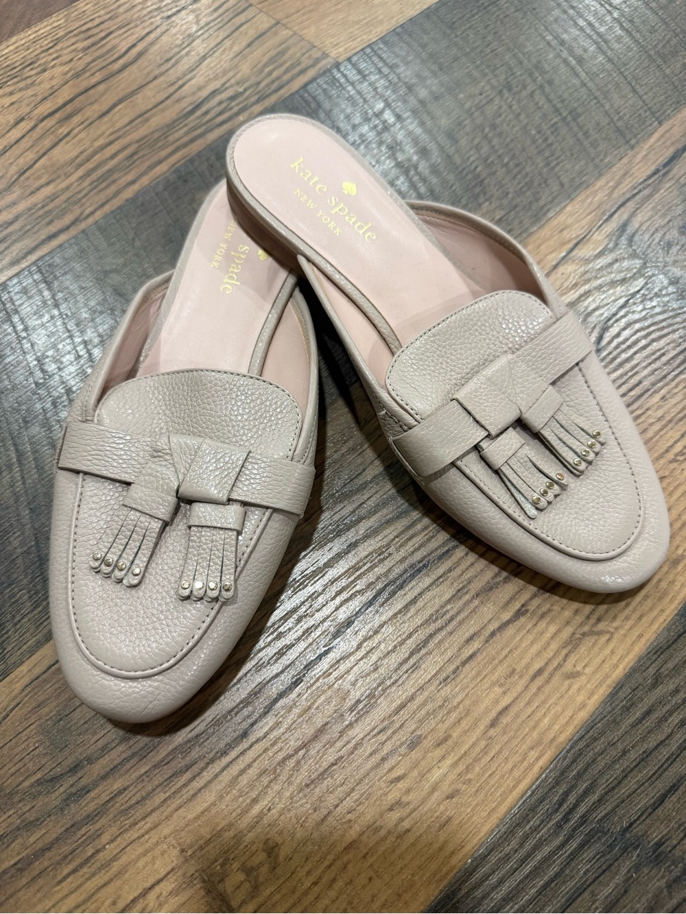 kate spade Pebbled Leather Tassel Backless Mules in Light Taupe
